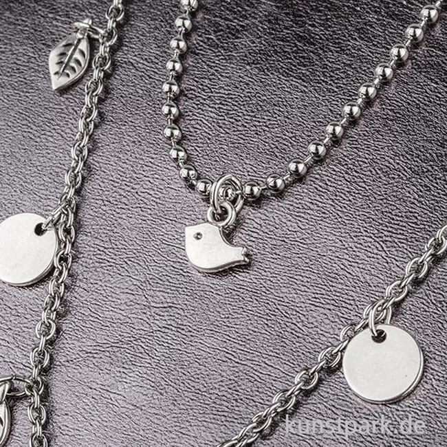 Artikelbild 2 des Artikels “Mini-Anhänger Metall - silberner Vogel, 6 Stück “